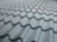 A metallic roof tile field viewed in perspective