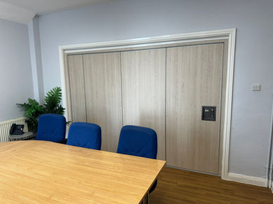 ASF100 sliding-folding wall system separating office