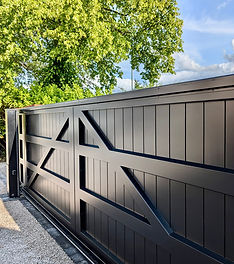 A modern, stylish electric gate in wood