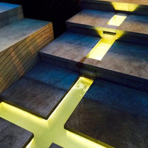 An illuminated cross set in stone