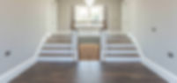 White wooden double staircase