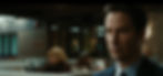 Keanu Reeves sitting in a McDonalds at night, in a suit, with a completely blank expression.