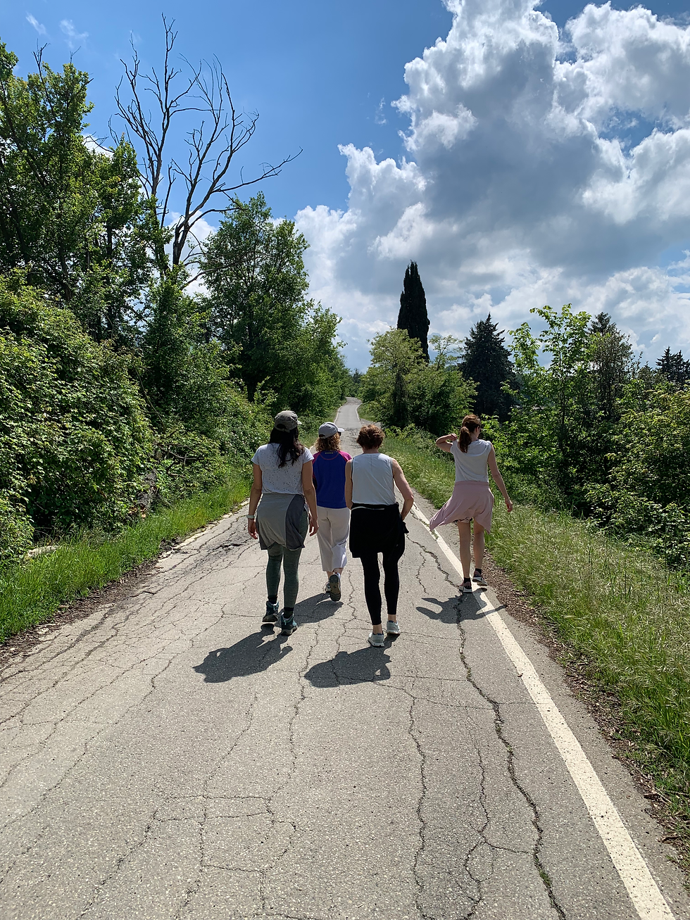 Guests walking on a road during a yoga retreat in Italy