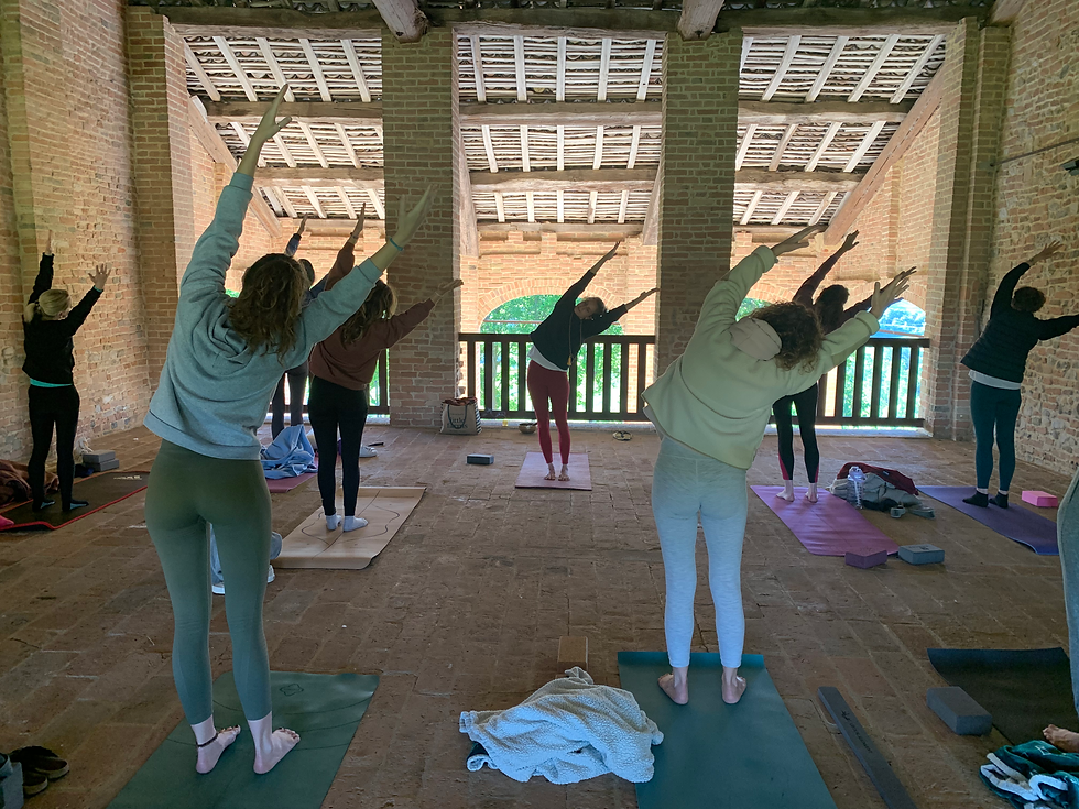 Group doing yoga at a retreat in Italy