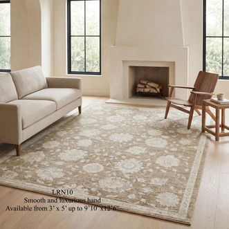 “Lauren vintage-style rug featuring distressed traditional motifs in ivory, beige, blue, and gray”