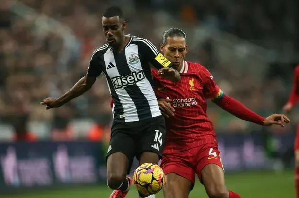 Alexander Isak battles with Liverpool captain Van Dijk.