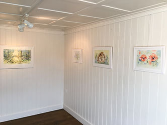 Forest clearing, white rose, bunny, poppy in watercolor