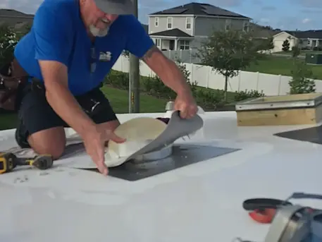 Failed roofing caulking and flash tape stripped from solar tube base removal