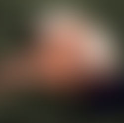 Woman curled up in bed