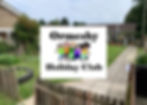 Ormsby Holiday Club sign with cartoon children over outdoor club entrance.