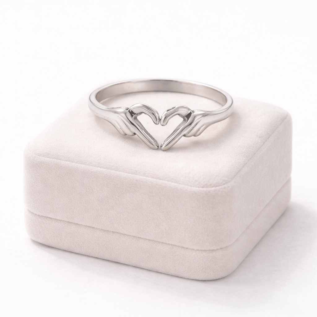 Adjustable stainless steel heart hands ring symbolising love and friendship – Love Link Ring.