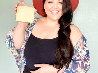 Lea Dixon The Platter Girl holding a wedge of manchego cheese