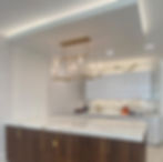 Calacatta Borghini marble with custom island, countertop, and full-height backsplash.