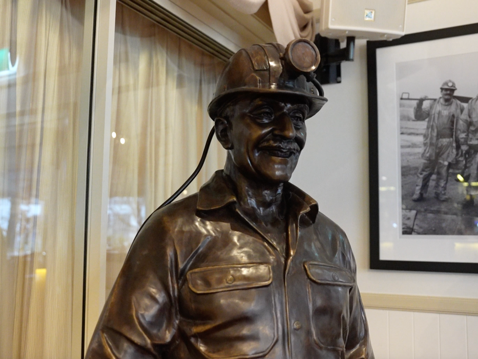 Bronze statue of a miner