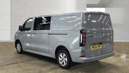Rear three quarter view of grey Ford Transit Custom showing back doors