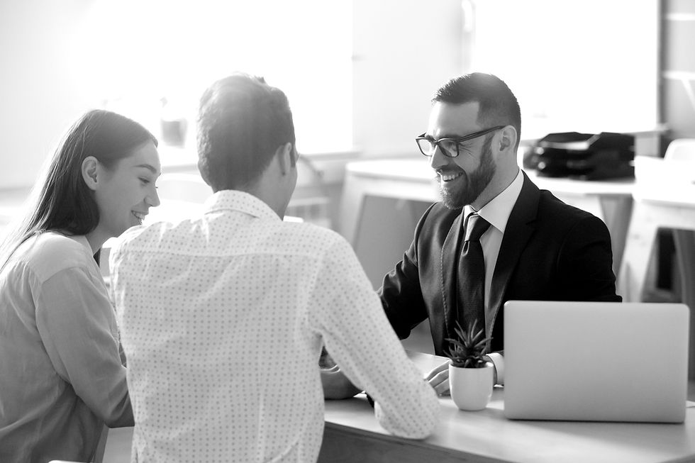 Smiling solicitor with two clients