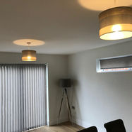 A modern living room with two ceiling lights