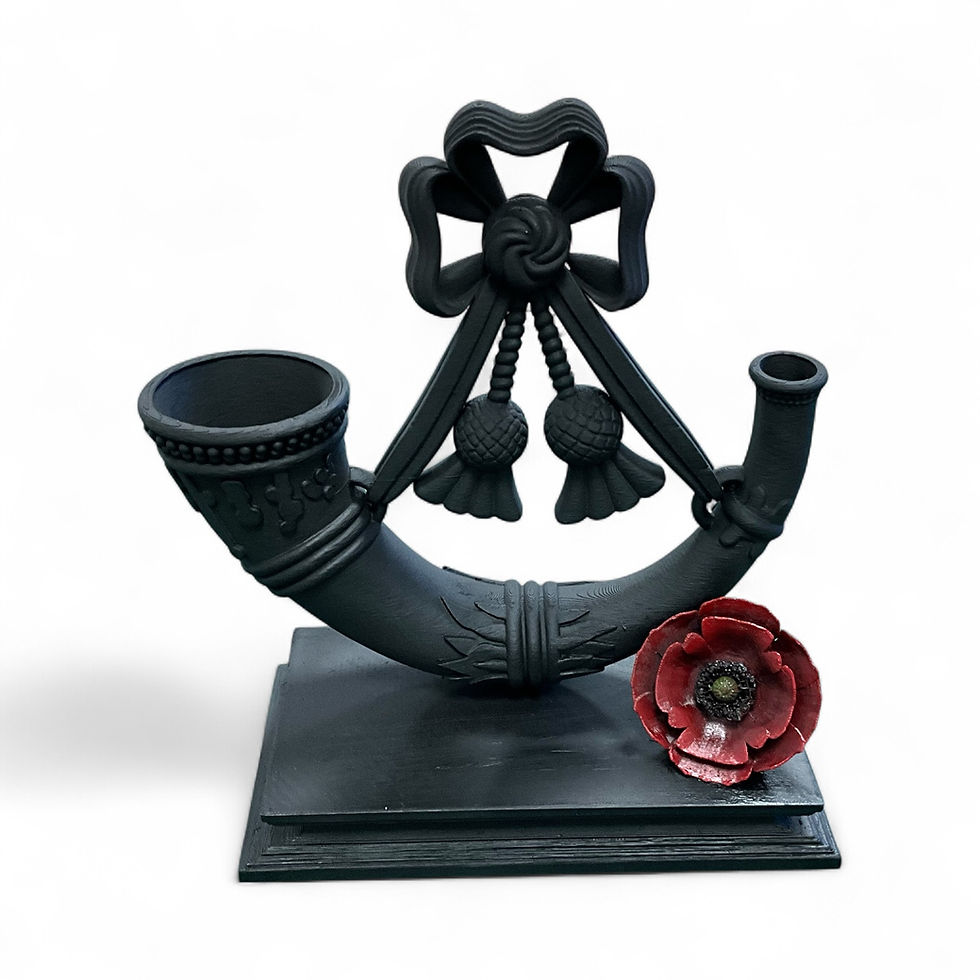 Light Infantry Cap Badge with bugle horn and remembrance poppy.