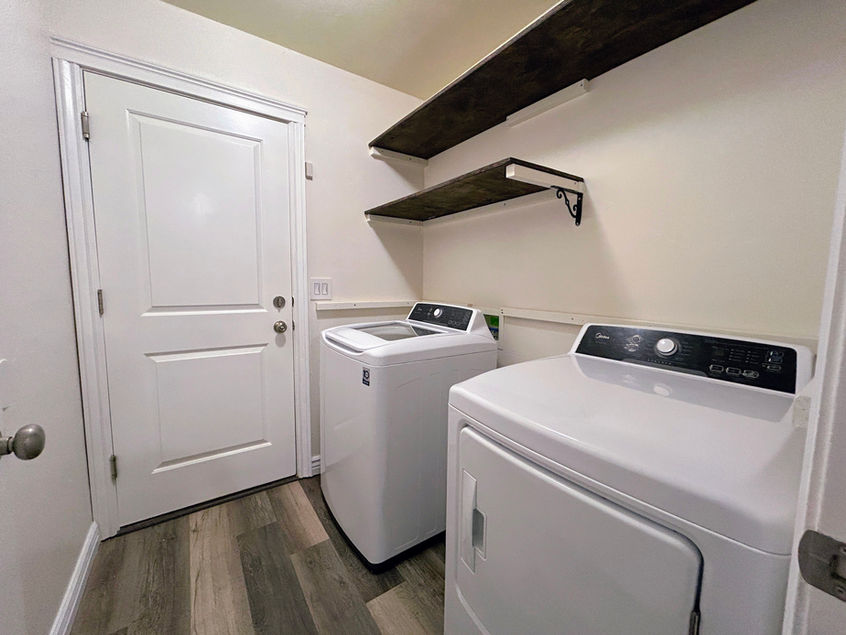 A washer and dryer in a laundry room