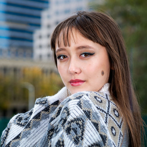 Senior Portraits of a young woman in Downtown Sacramento, California by Nathan Anglin.