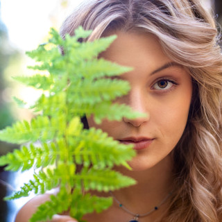 Abstract Senior Portrait with a fern in front of the model by Nathan Anglin in Grass Valley, CA