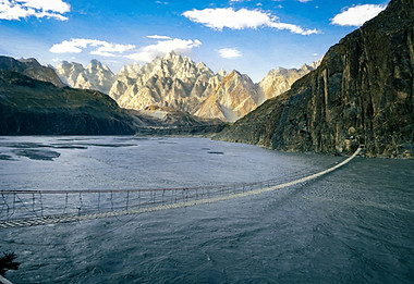 Suspension bridge river crossing trail running Karakoram Mountains Pakistan Run Weekends