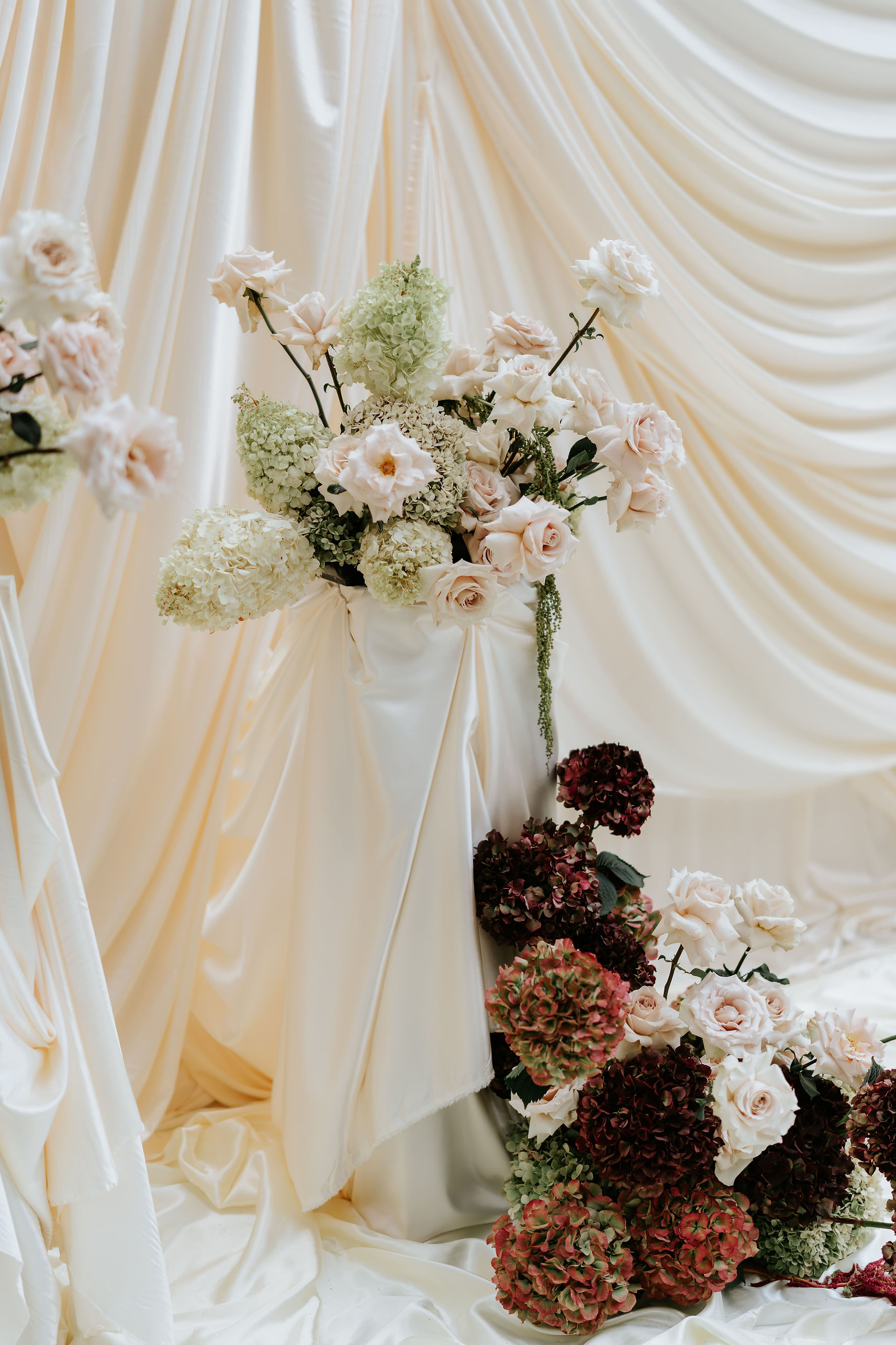 wedding decor inspiration with calm whites and deep burgundy accents