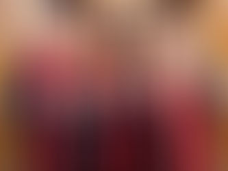 Three University of Utah graduates in caps and gowns posing together at a Rocky Mountain Photo Booth with gold sequin backdrop