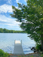 View of the dock from the camp on Schoodic Lake