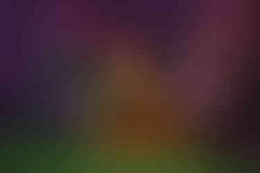 Mother holding child against soft neutral backdrop during studio session