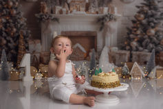 Happy baby enjoying a cake smash photoshoot at Kidi Photography Wolverhampton
