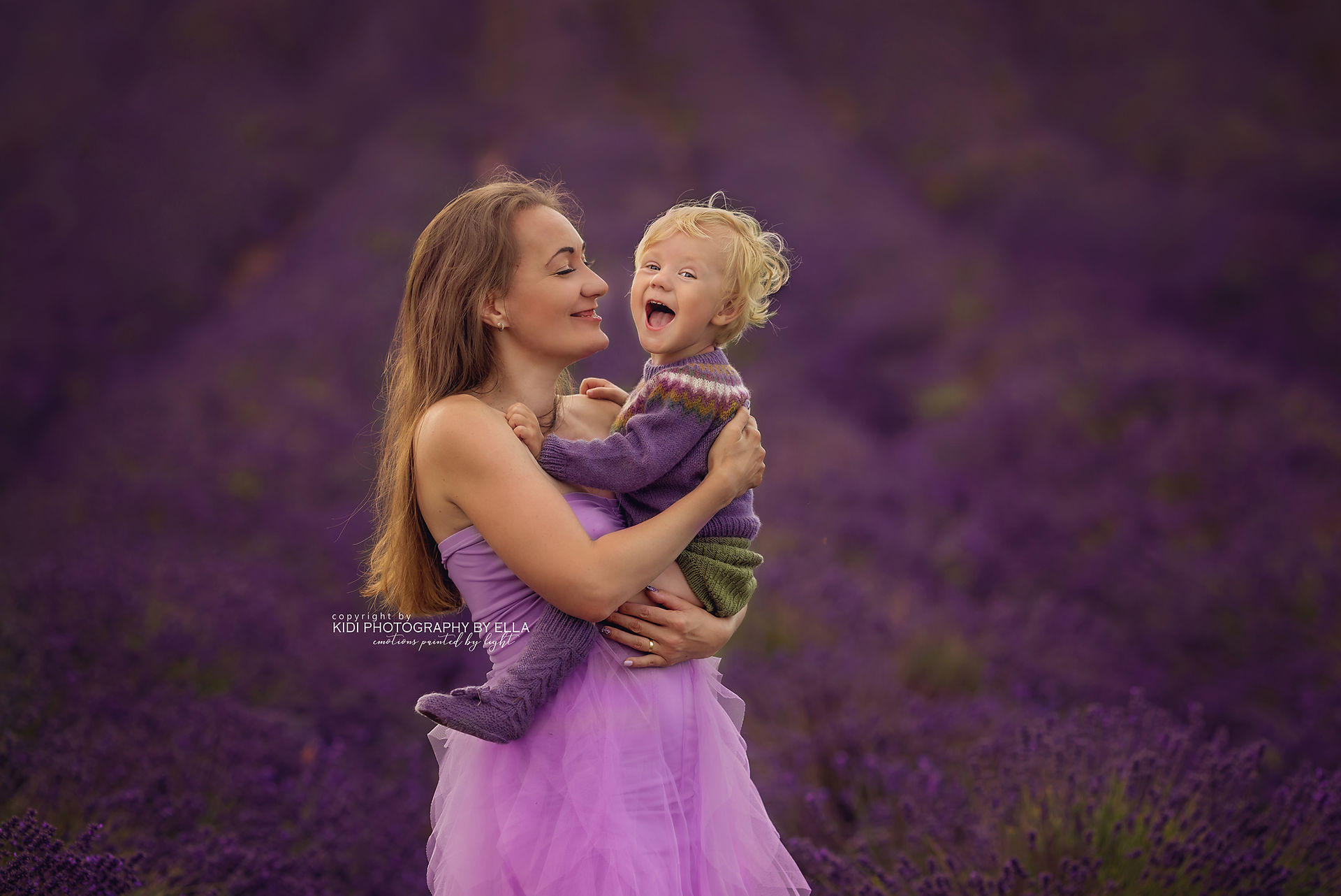 Family photography session capturing emotional moments in lavender fields.