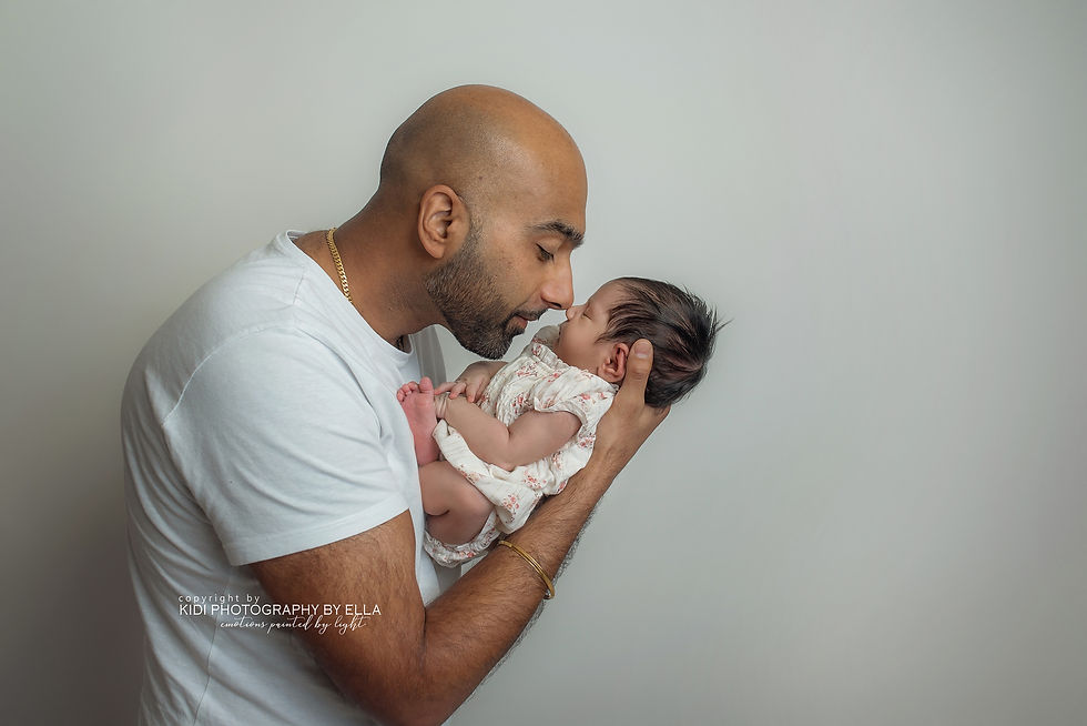 Newborn baby swaddled in beige blanket – studio newborn photography Wolverhampton