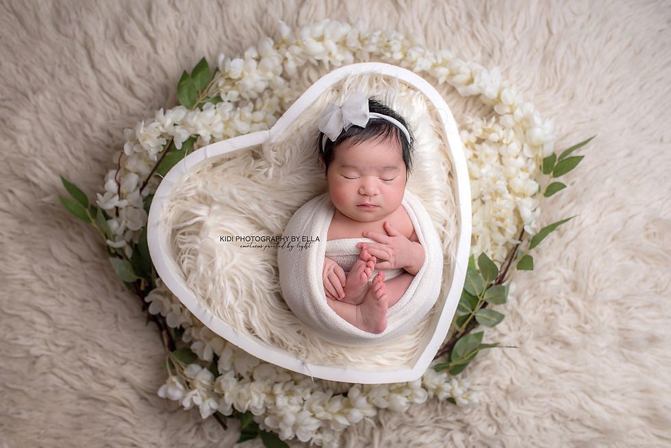 Newborn baby girl Jasmine sleeping peacefully during her Wolverhampton photography session