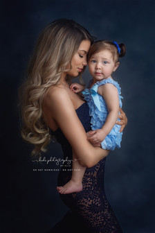 Glamorous studio portrait of mother with her child in elegant setup Wolverhampton