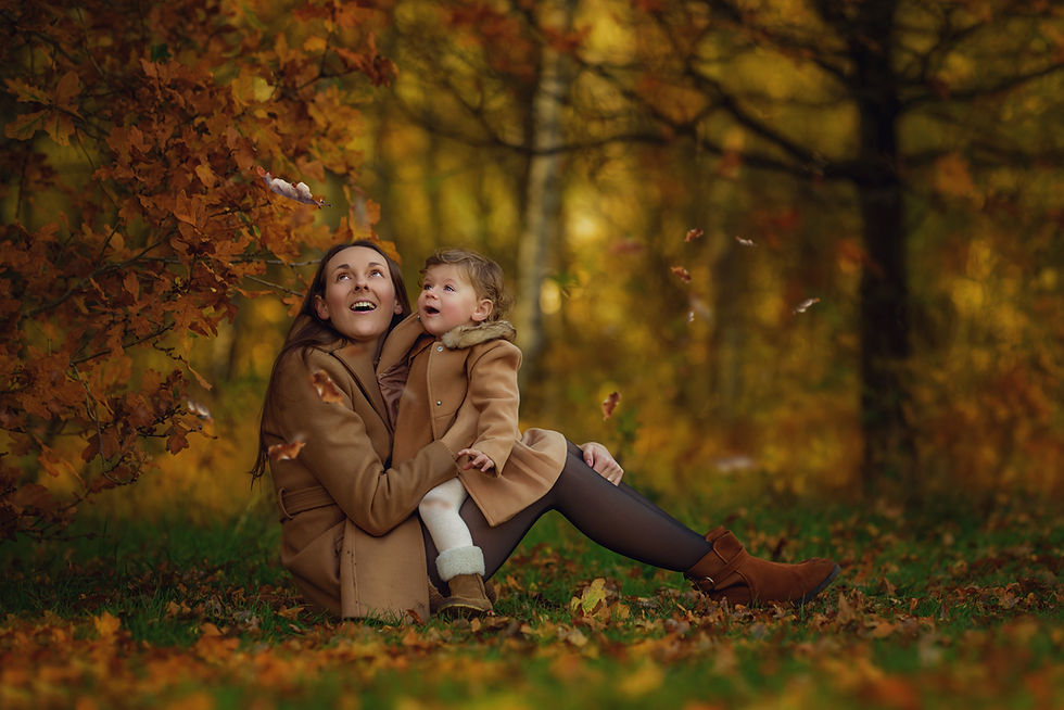 Toddler playing with autumn leaves – outdoor children’s photographer West Midlands