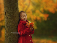 Mother and daughter walking hand in hand through a field