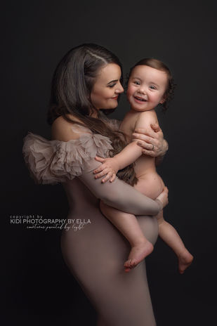 Pregnancy photoshoot in Wolverhampton featuring soft light, minimal styling and emotional connection