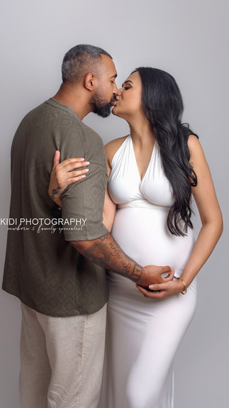 Elegant maternity photography session in Wolverhampton with expecting mother in a flowing gown, soft fine art styling by Kidi Photography