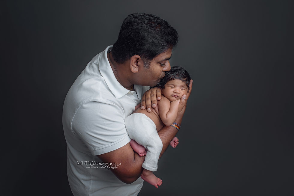 Dad kissing newborn baby son - Newborn Photographer Walsall