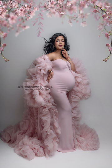 Soft maternity photography with natural light and neutral palette