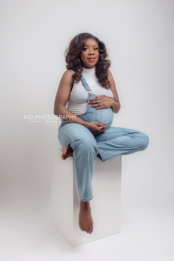 Maternity photoshoot in West Midlands studio with soft beige tones