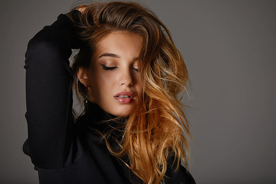 fashion-portrait-nice-model-woman-with-long-healthy-hair-black-dress-gray-background-beaut