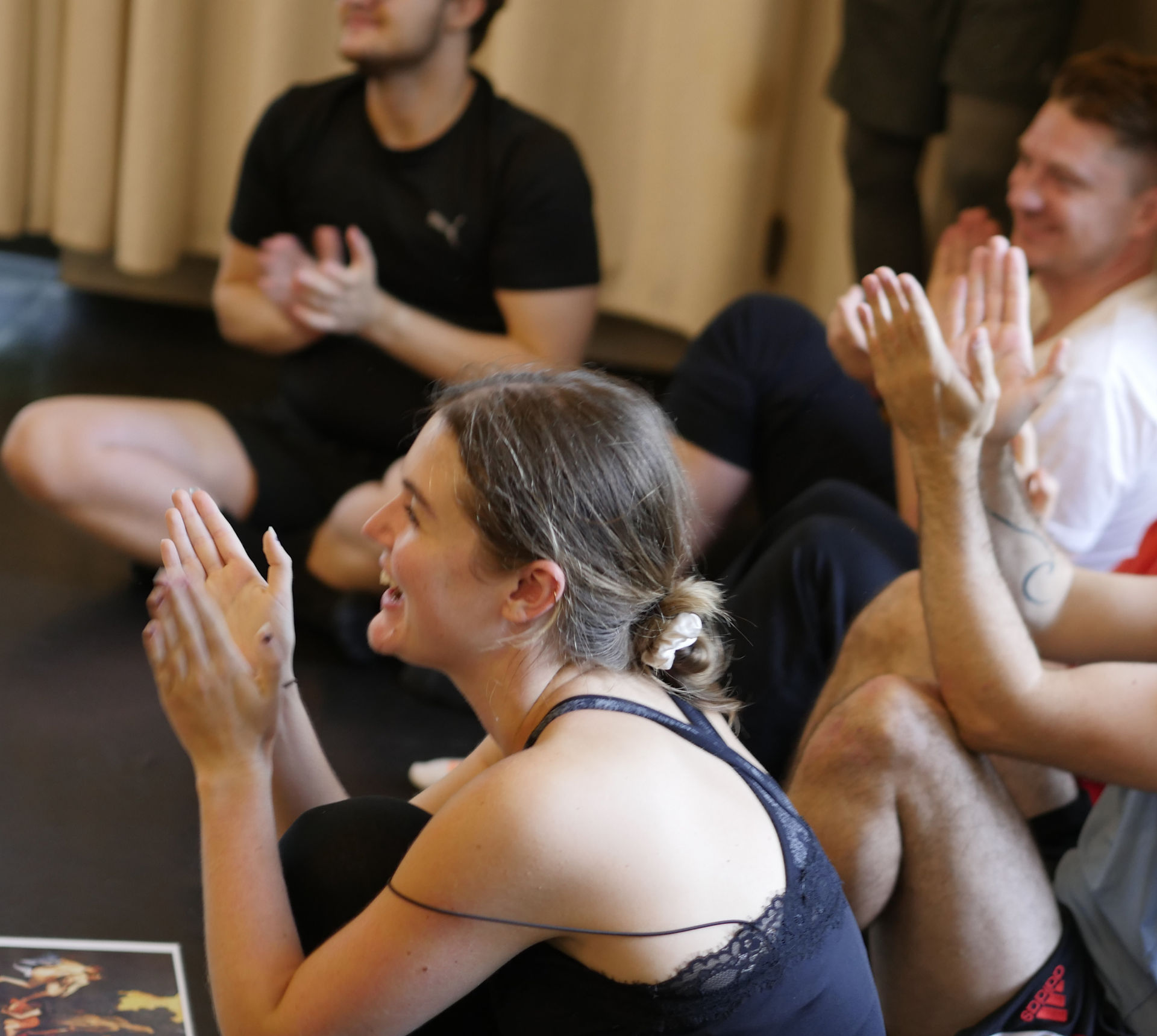     Participants applaud and support one another during NIPAI’s Acting in Physical Theatre workshop.