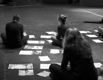 Creative process behind collage-based performance: source materials, rehearsal research, script notes, and compositional work in theatre and studio spaces
