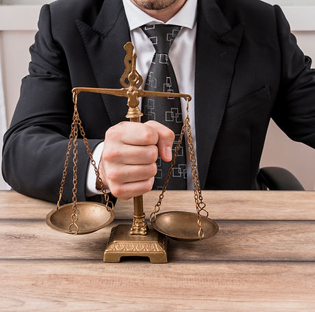 lawyer-with-weighing-scales.jpg