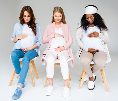 1 multiracial-pregnant-women-looking-down-and-touchi-2022-12-16-18-44-58-utc (1)_edited.jp