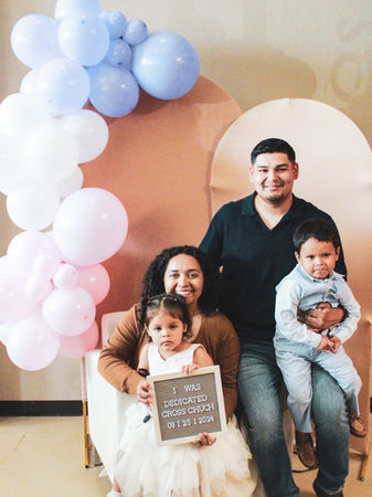 Heartwarming child dedication ceremony in a welcoming church setting, with families and pastors gathered to bless and pray for the children. A moment filled with love, faith, and commitment to raising children in a spiritual foundation.