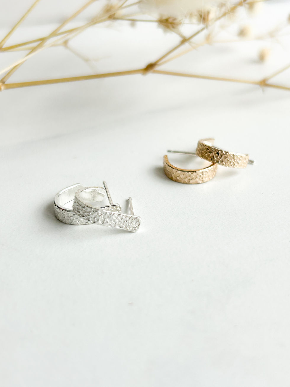 Thumbnail: silver and gold huggie earrings