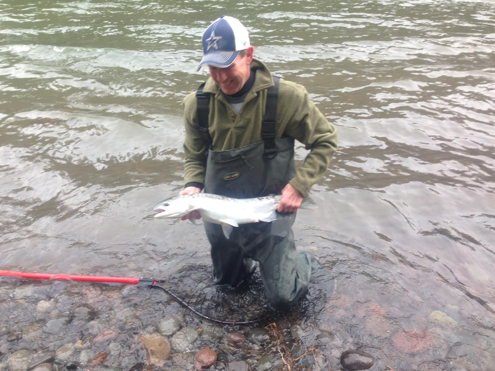 young man with fish in river.jpg